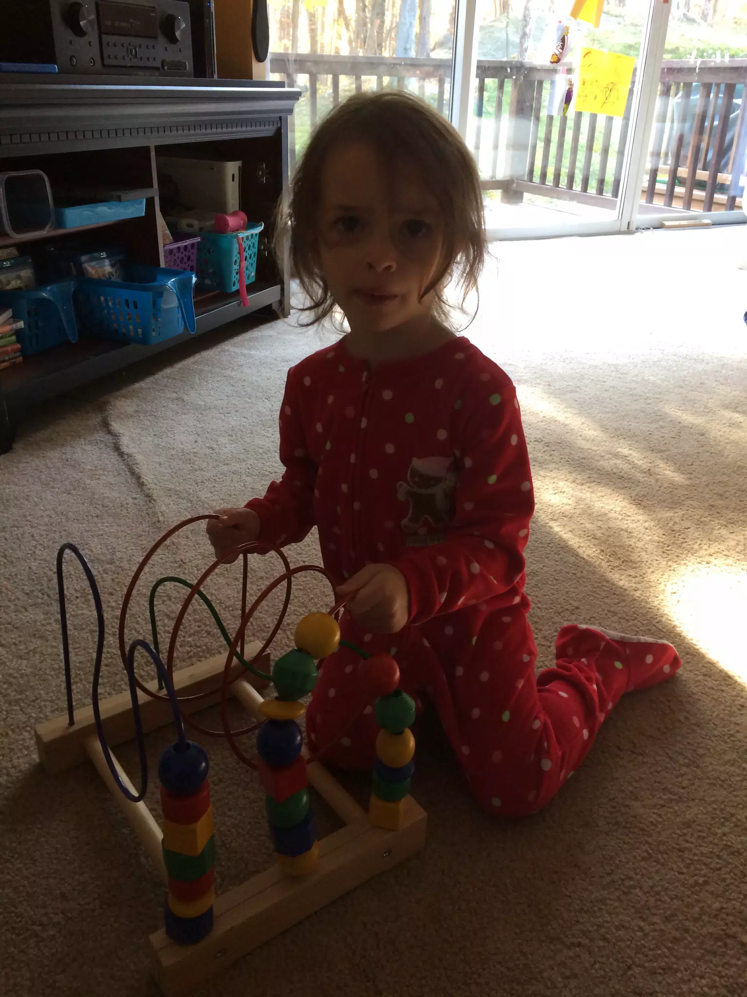 Luciana playing with one of her toys before it is donated.