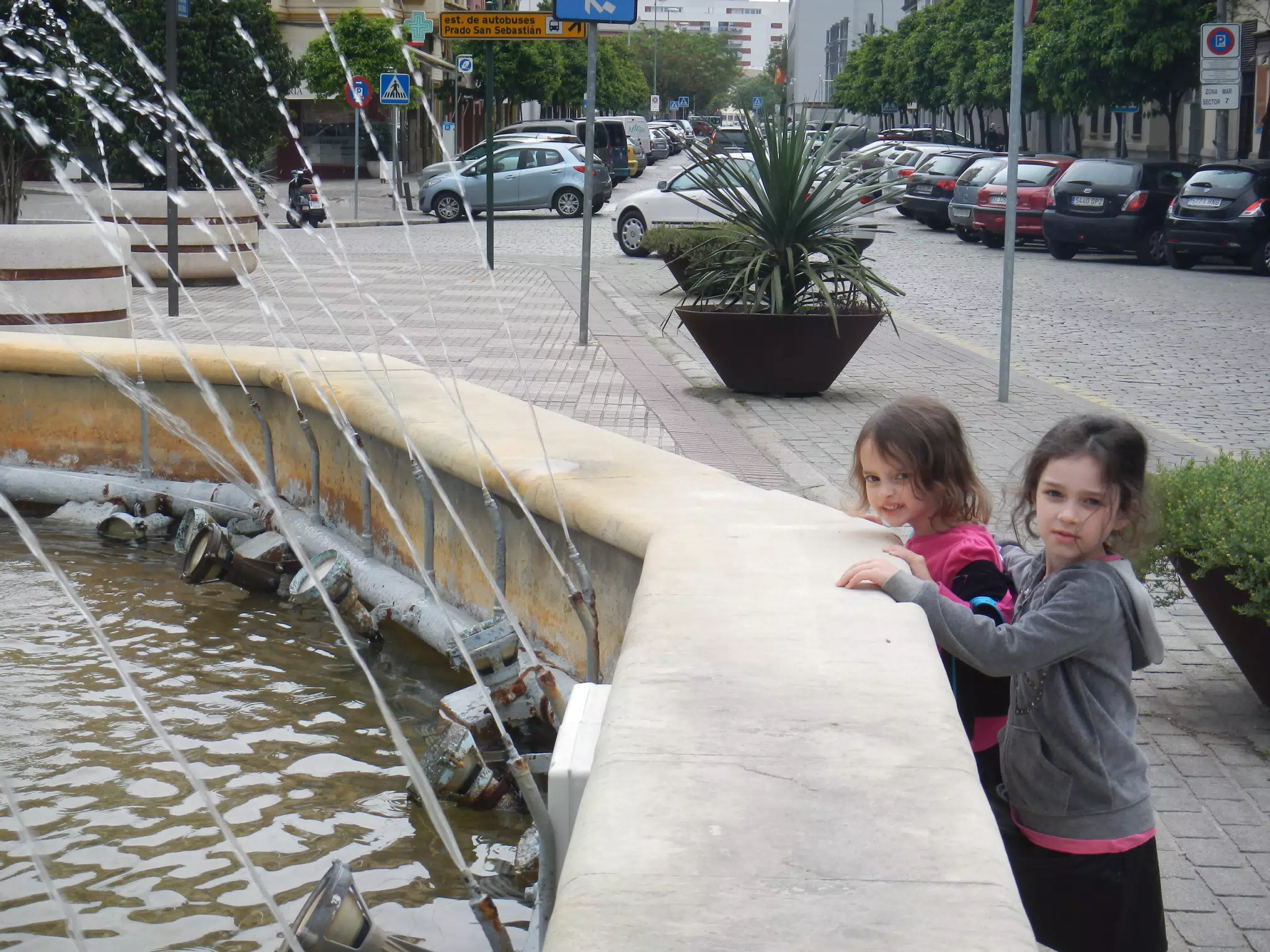 The Girls by a Fountain Near Our Apartment