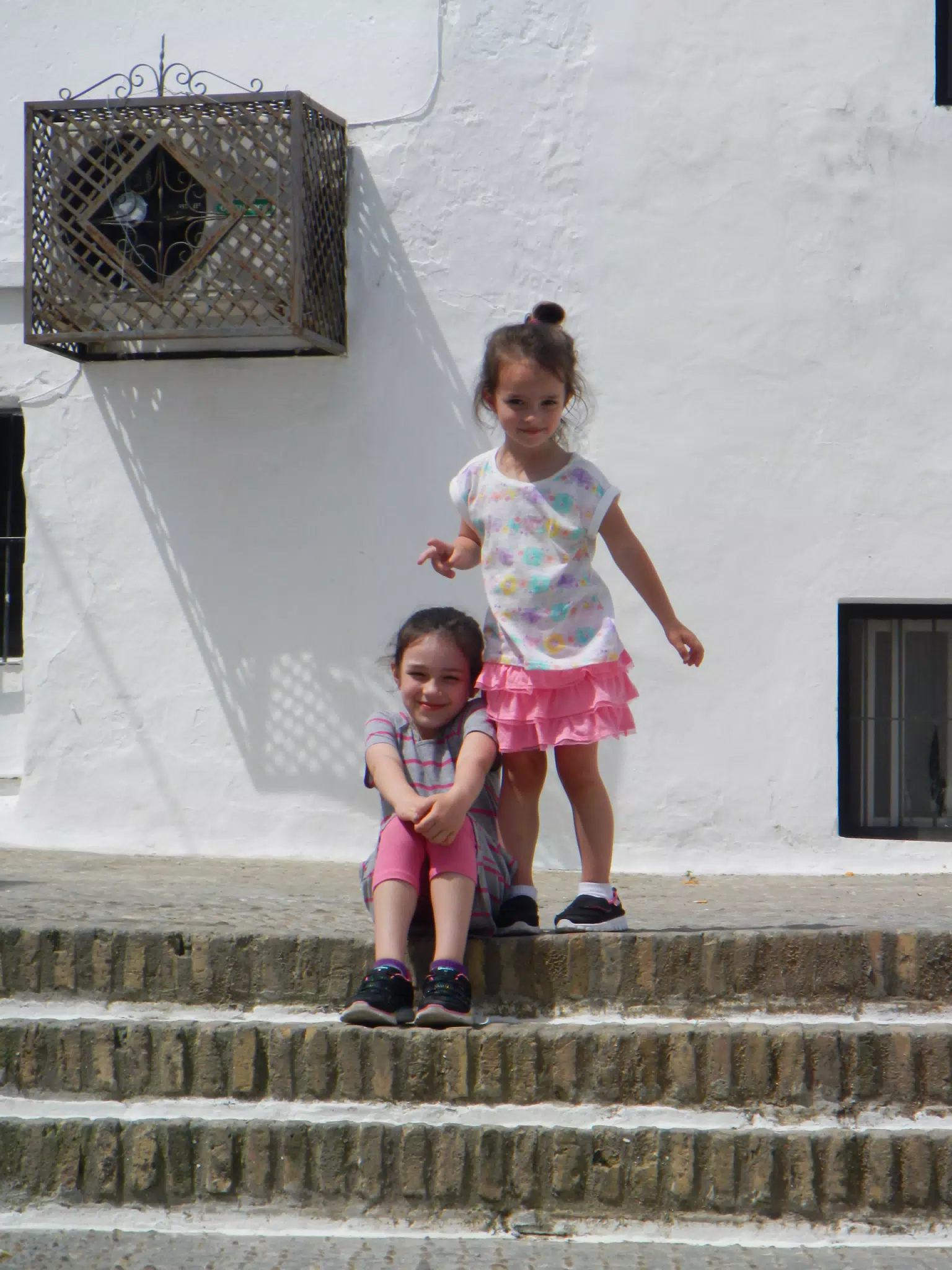 Liesl and Luciana on Steps in Arcos de la Frontera