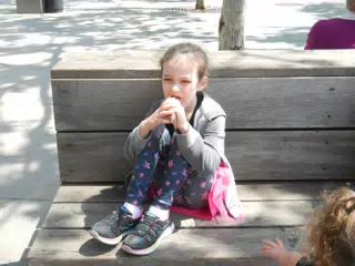 Liesl Eating Ice Cream on Bench