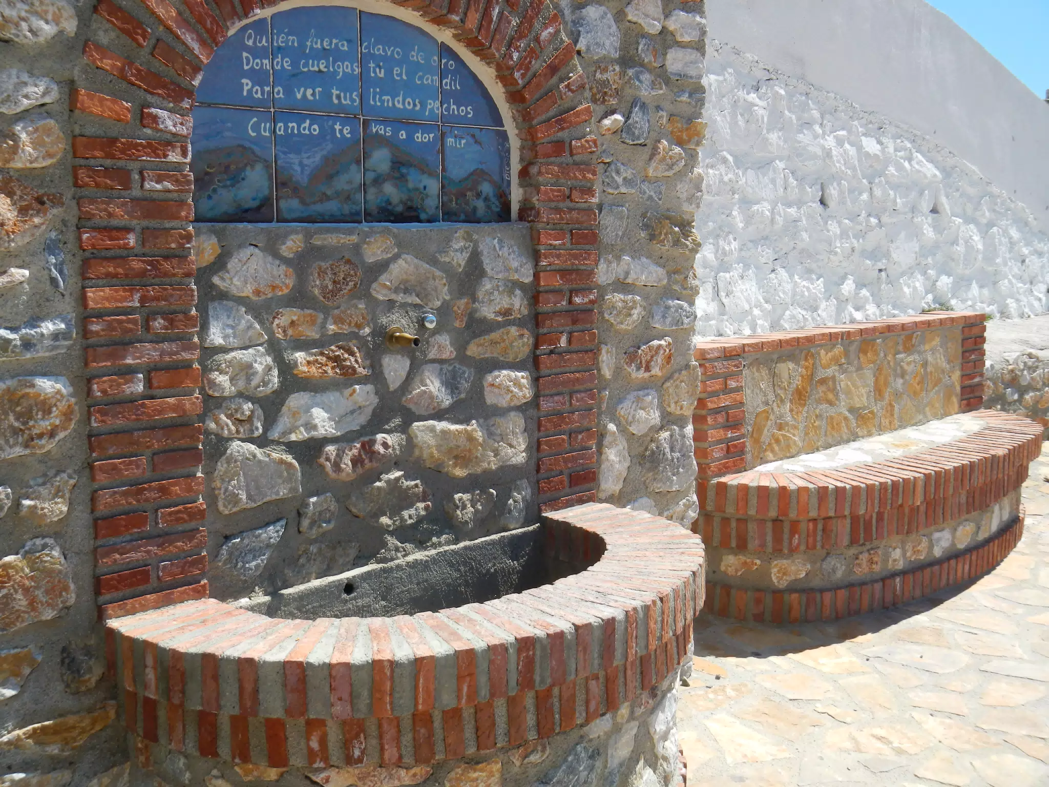 Fountain by School and Bench