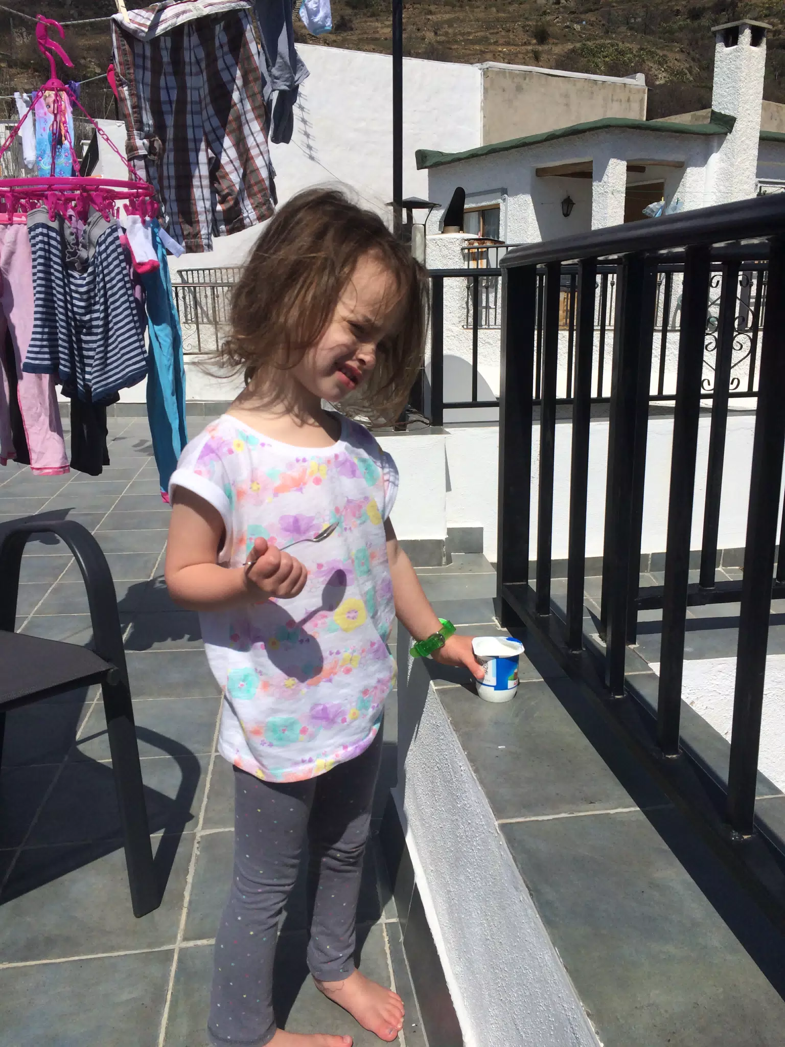 Luciana Enjoying Yoghurt on the Terrace