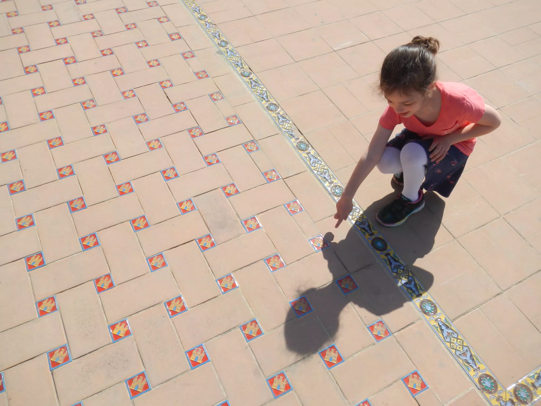 Liesl Showing Ground Tile Details in the Plaza de España