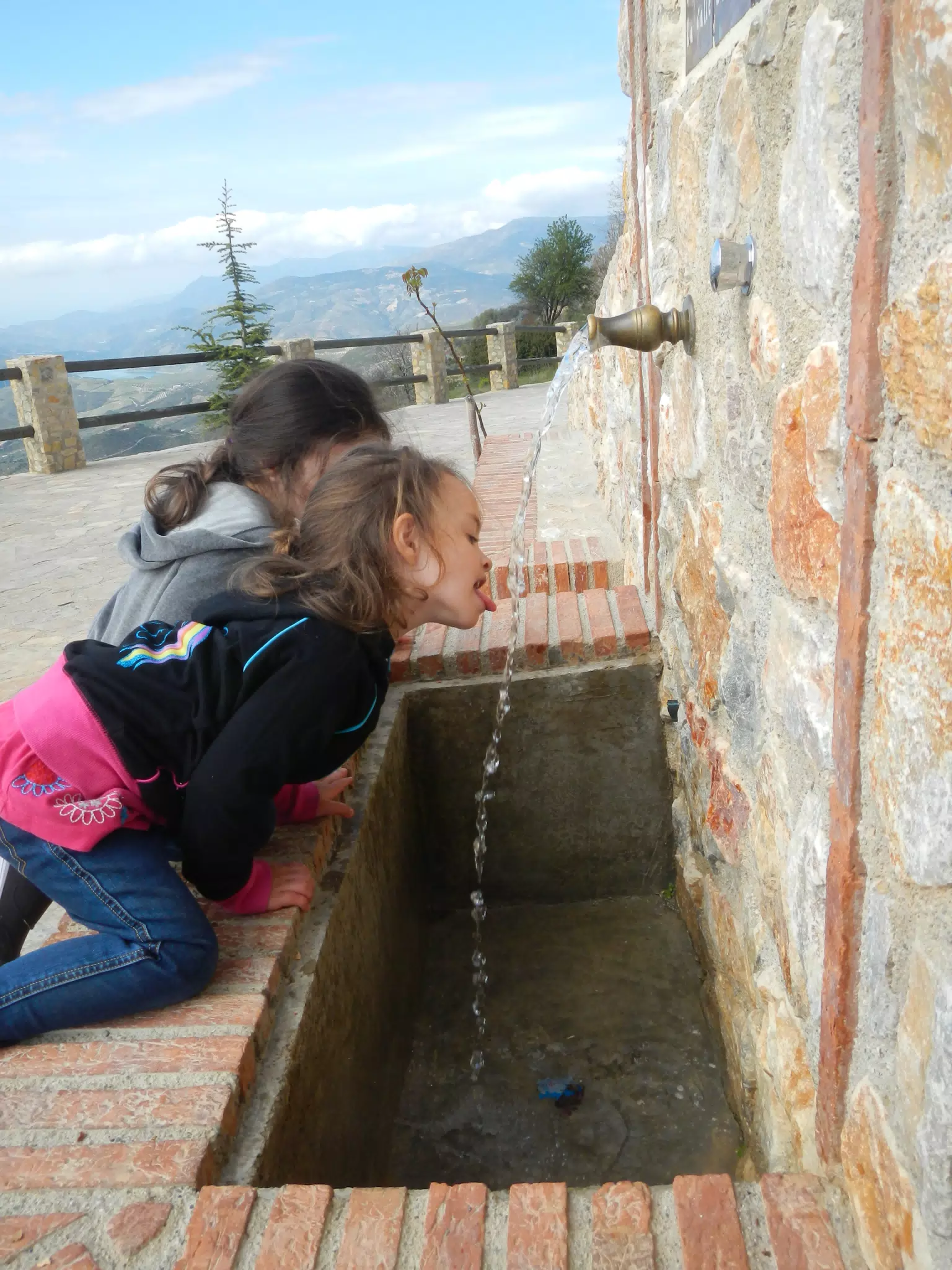 Luciana Drinking from a Fuente on the GR7