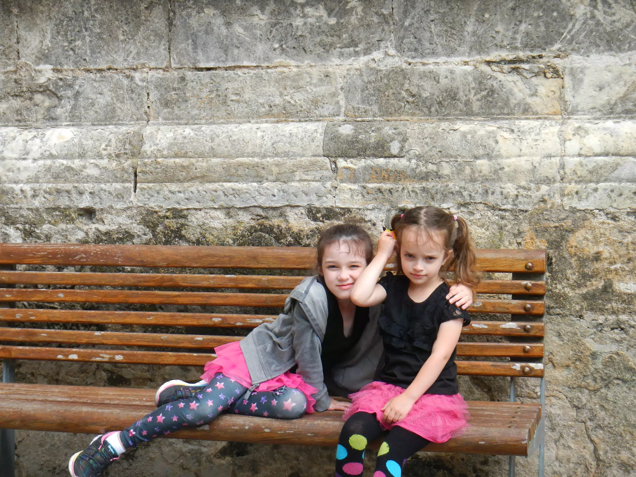 The Girls on a Bench in Front of Sevilla Cathedral