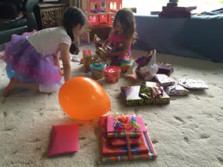 Liesl and Luciana Opening Presents on the Farm