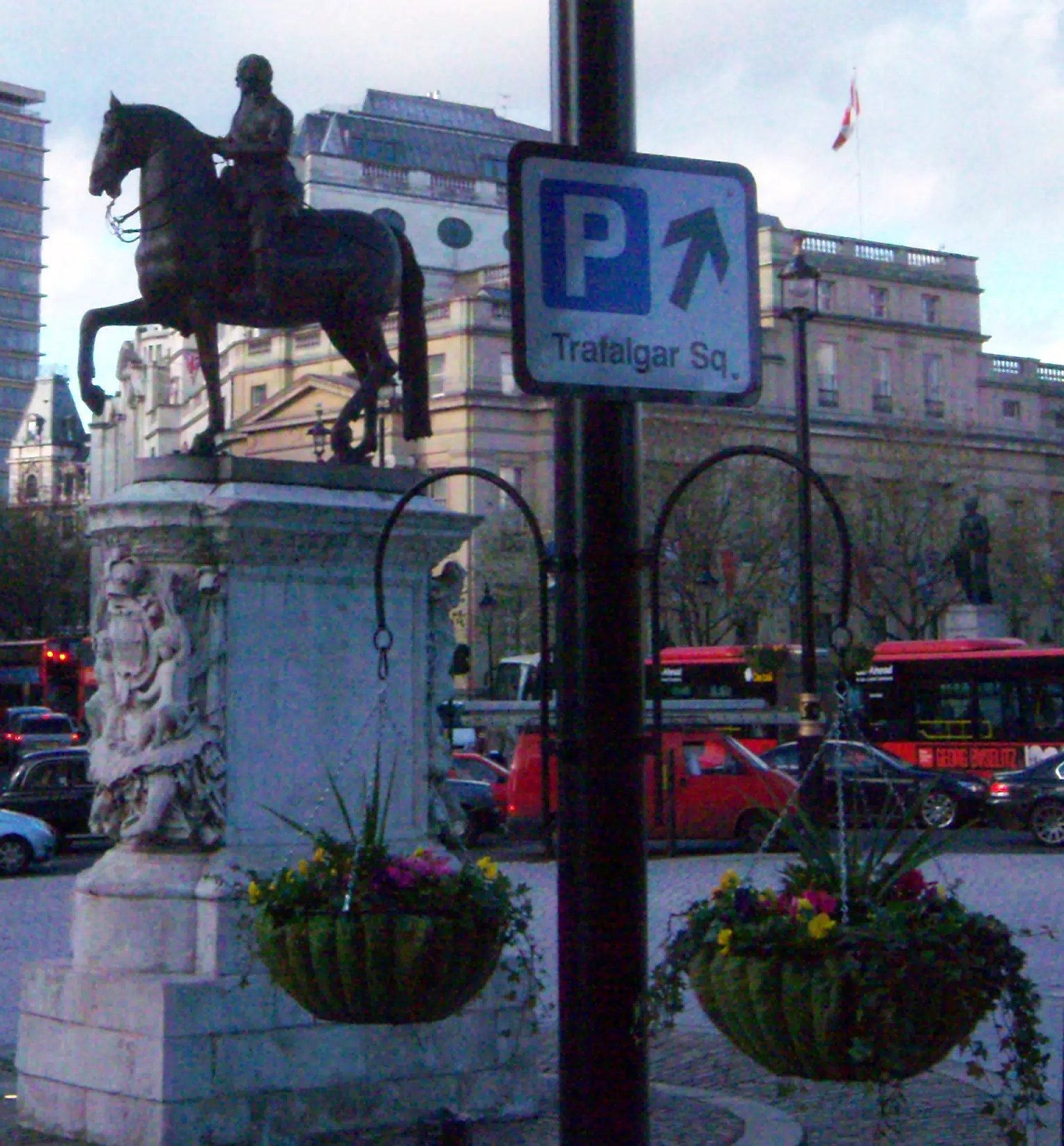 Flowers, Parking Sign and Statue in London