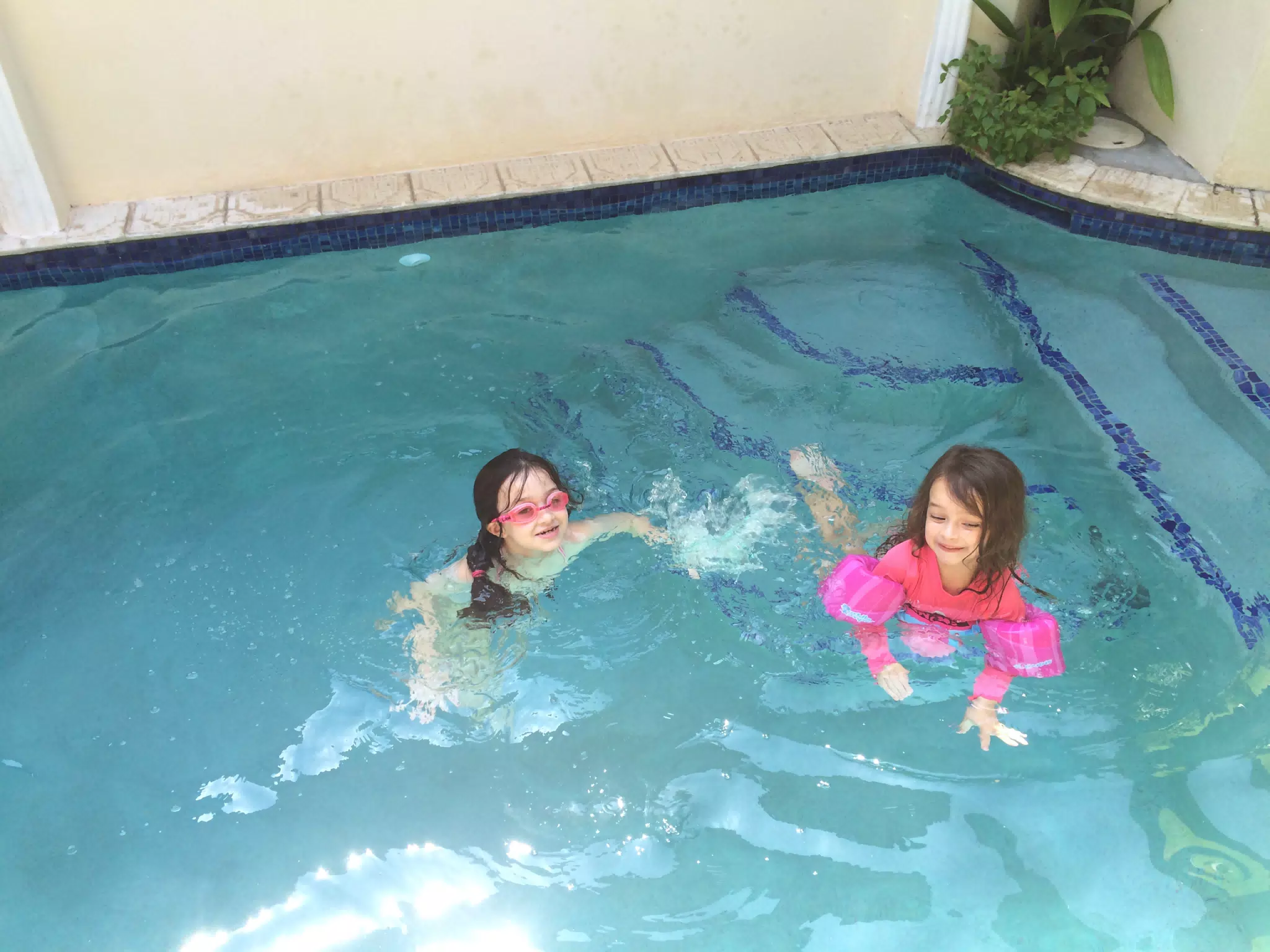 Liesl and Luciana Swimming in the Pool at the House