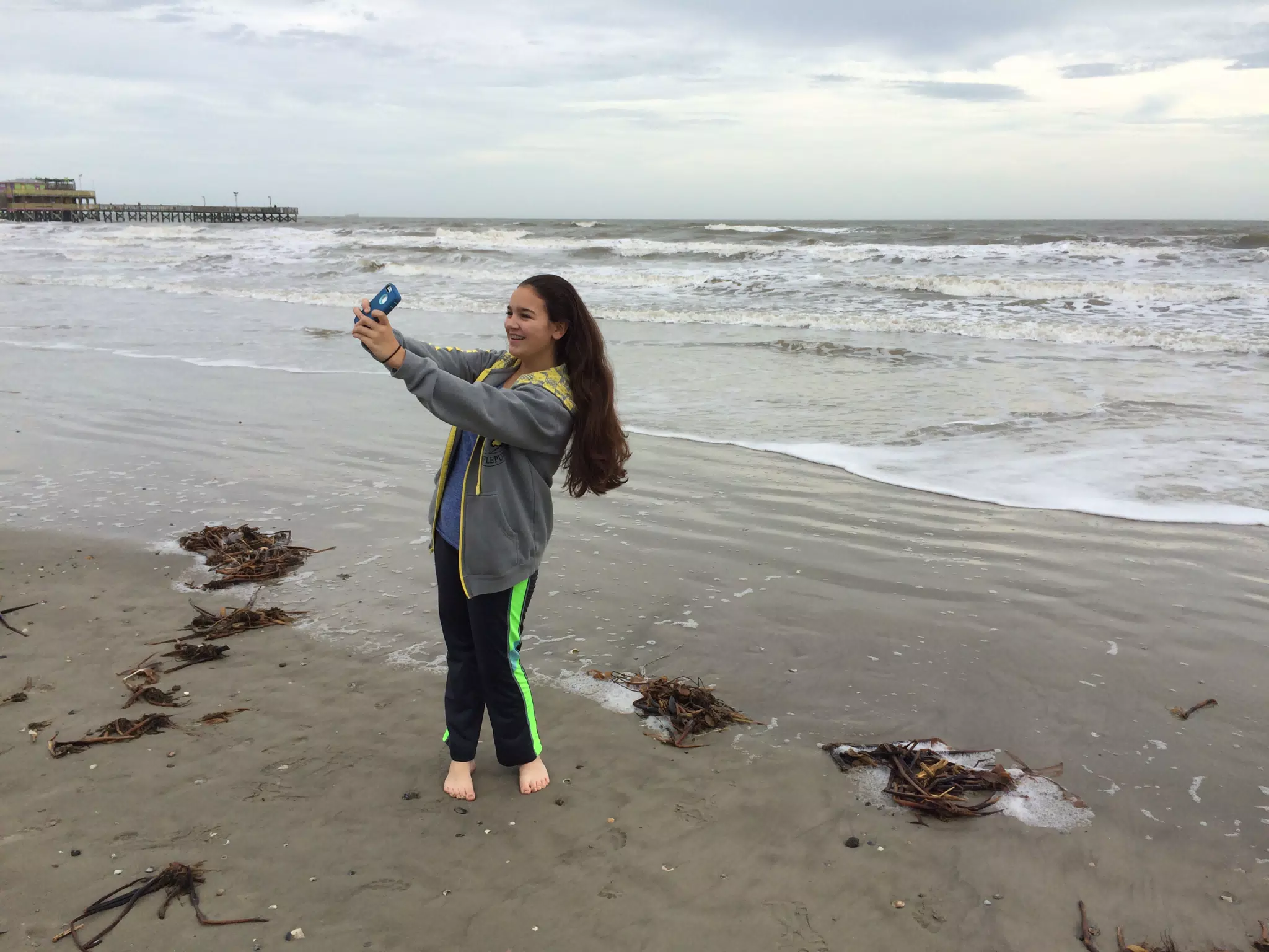 Emily on Galveston Beach Taking a Selfie