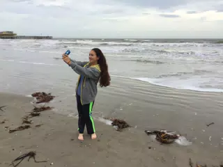 Emily on Galveston Beach Taking a Selfie