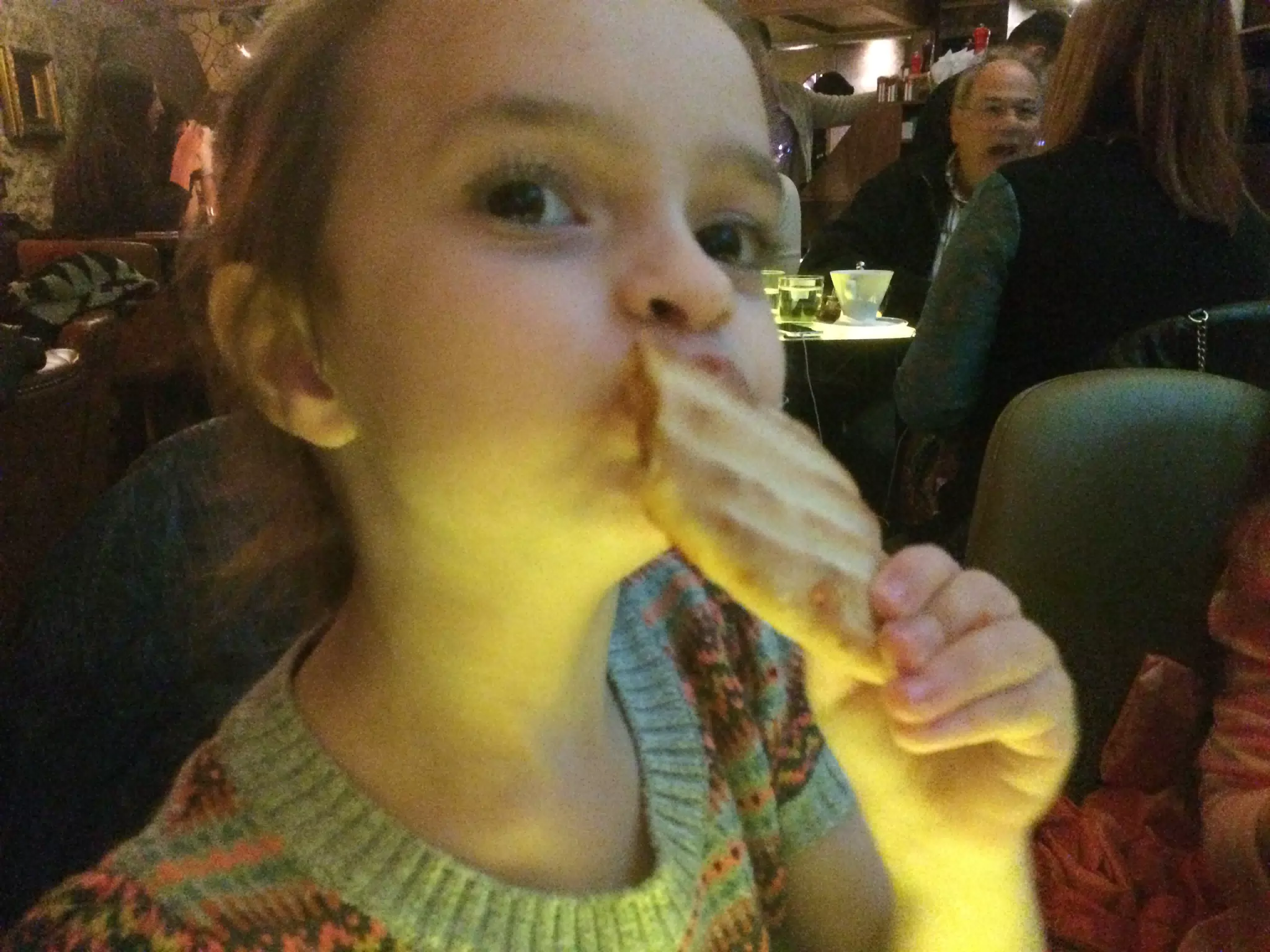 Luciana Eating Pizza at the Living Room Lounge