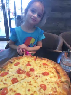 Luciana with Pizza