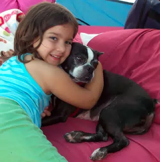 Emily Giving Oreo a Hug in the Tent