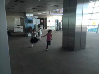 Girls Running in Airport