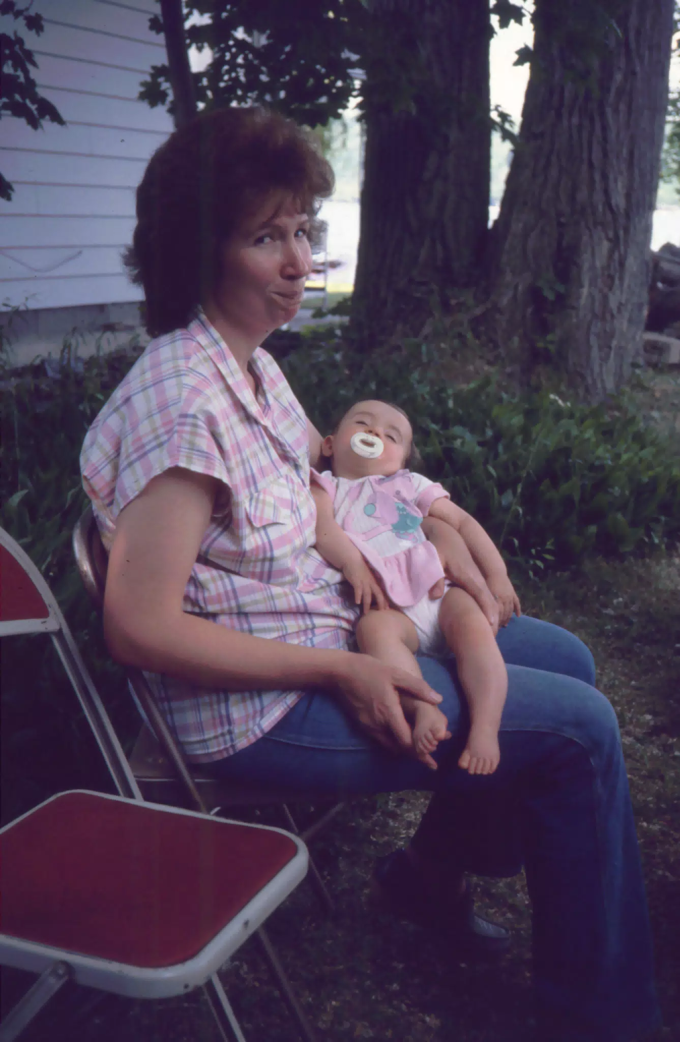 Aunt Sharon Richardson holding my cousin Sara Richardson at Conesus Lake