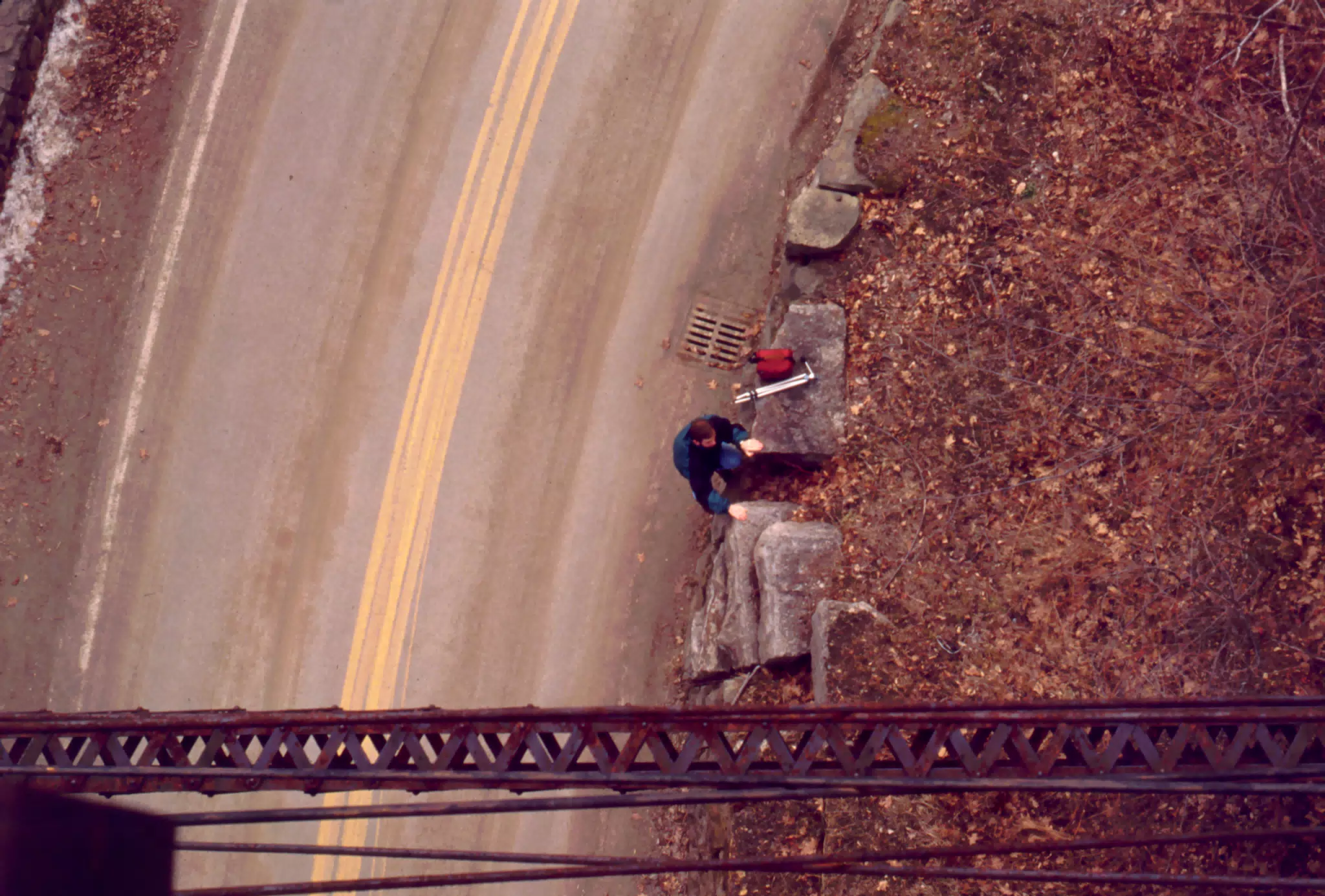 Nate Parker on Rocks Beneath Train Trestle in Letchworth State Park