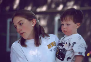 Leanne Cooley Holding Her Nephew Daniel Cooley at Her Graduation Party