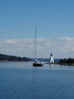 Sailboat and Lighthouse on Bras D'Or Lake, NS