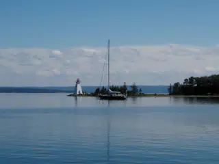 Sailboat by Lighthouse on Bras D'Or Lake, Nova Scotia