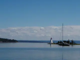 Sailboat by Lighthouse on Bras D'Or Lake, Nova Scotia