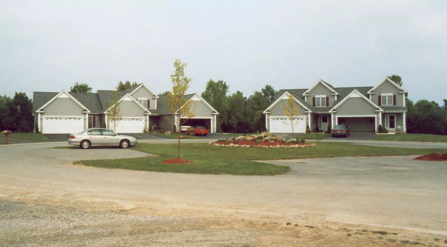 Geneseo Townhouse with Camaro in Driveway