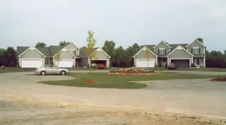 Geneseo Townhouse with Camaro in Driveway