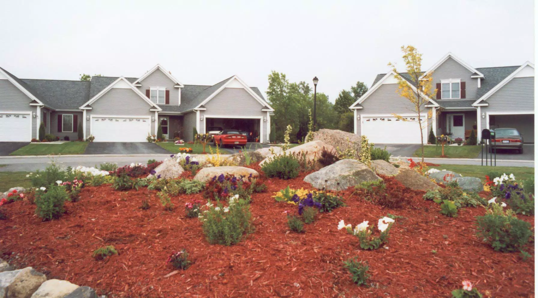 Geneseo Townhouse with Camaro in Driveway