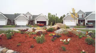Geneseo Townhouse with Camaro in Driveway