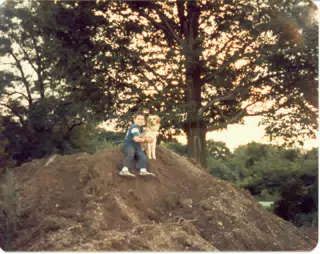 Scott Alan Miller and Lady on top of dirt pile
