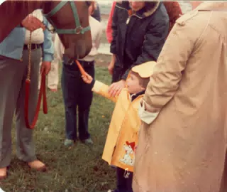 Melody Receiving Carrot from Child