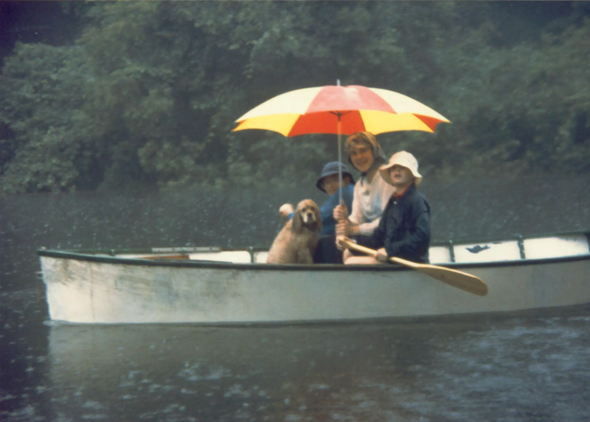 Scott Alan Miller, Karen Miller, Jonathan Stagno and Buffer in Rowboat in Rain