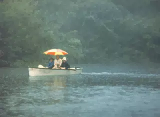 Scott Alan Miller, Karen Miller, Jonathan Stagno and Buffer in Rowboat in Rain