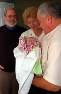 Uncle Leo, Aunt Sharon and Grandpa Miller with Baby Liesl