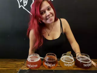 Rachel with Beer Flight at Taps & Caps