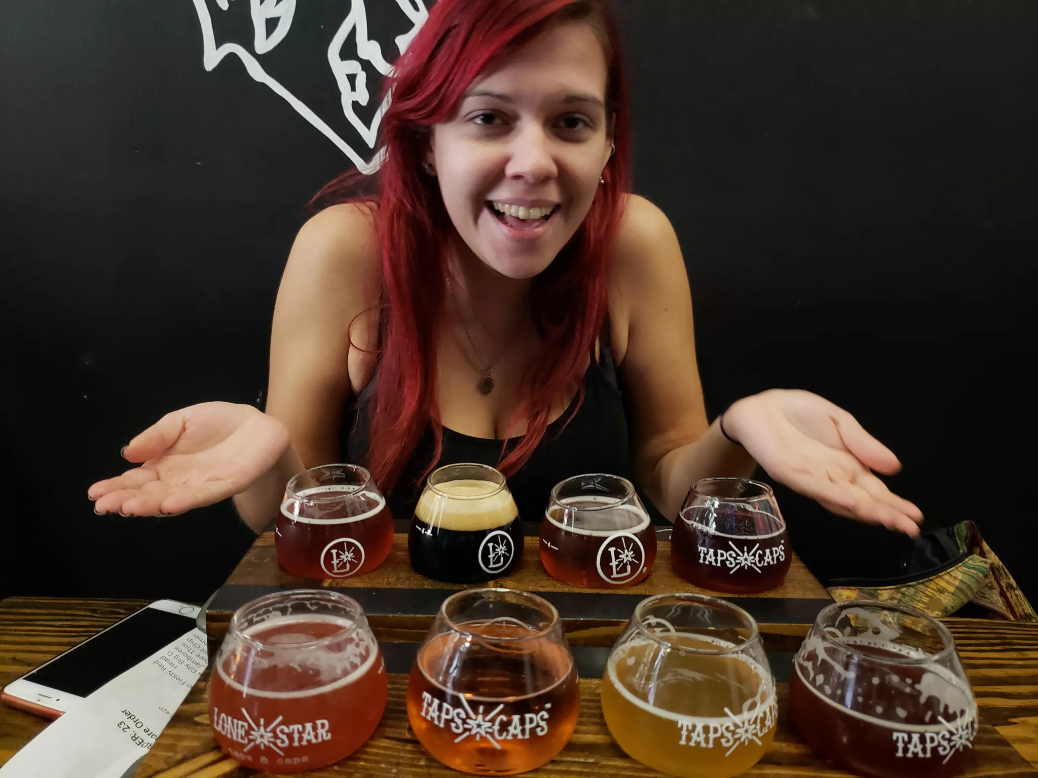 Rachel with Beer Flights at Taps & Caps in Texas