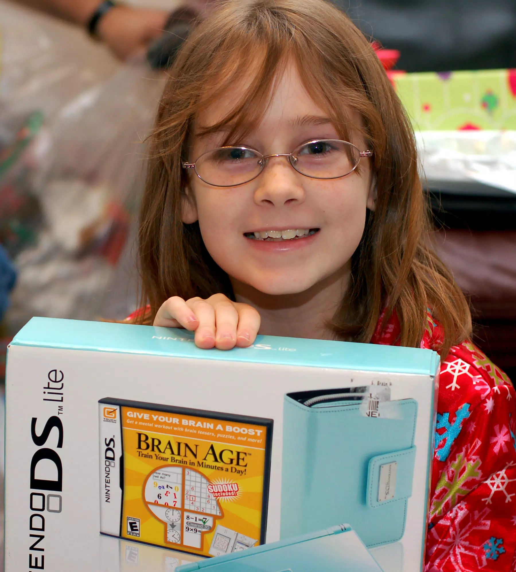 Madeline Showing Her Ice Blue Nintendo DS for Christmas