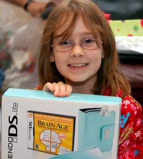 Madeline Showing Her Ice Blue Nintendo DS for Christmas