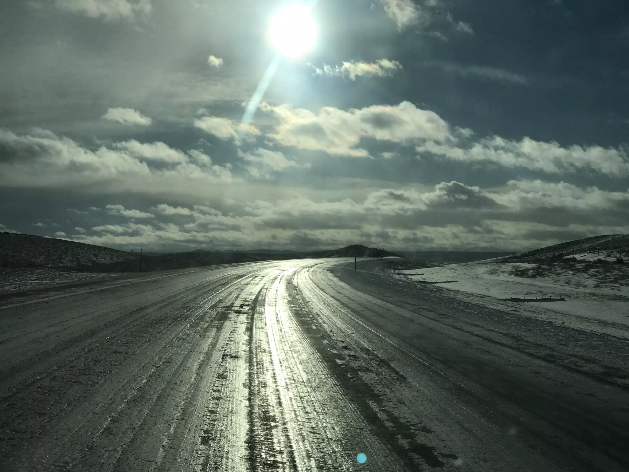 Driving Wyoming Highway Southbound at Sunset