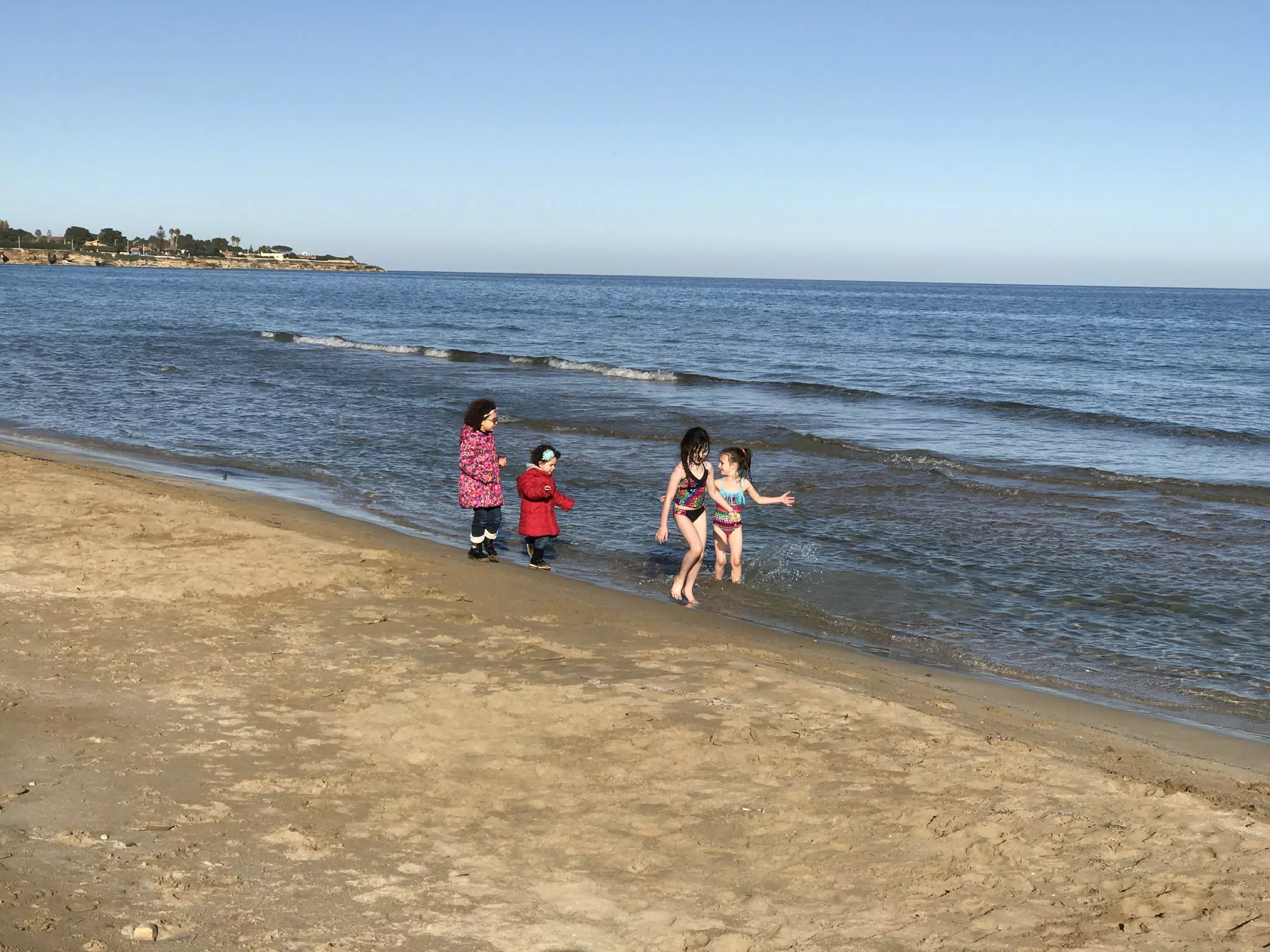 The Girls Playing on the Beach in Avola
