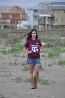 Emily Thumbs Up Aggies Sign