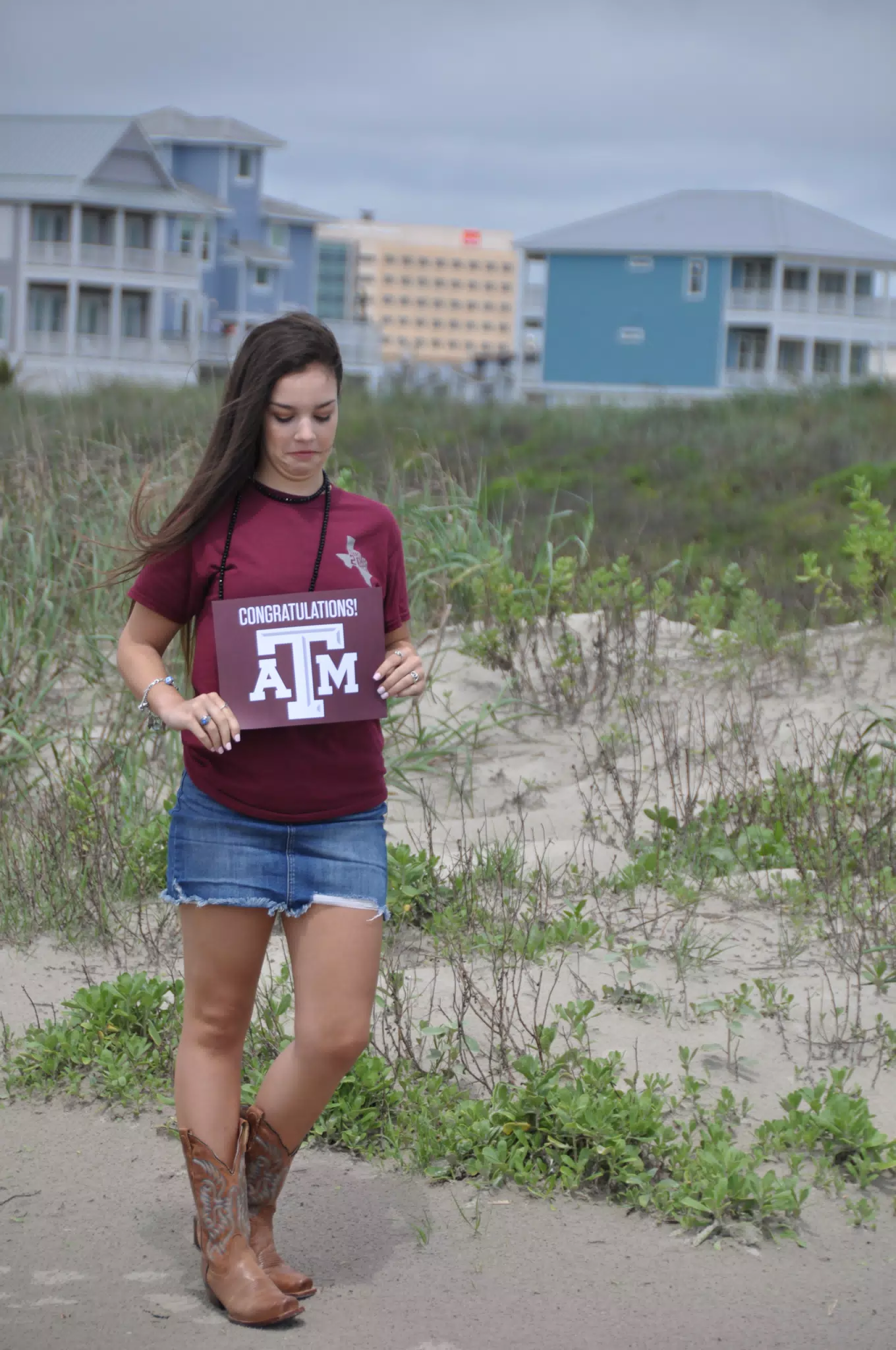 Emily Looking at Aggies Sign