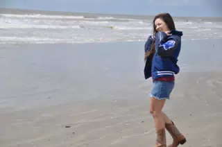 Girl Laughing in Denim Skirt on Galveston Beach in Cowgirl Boots