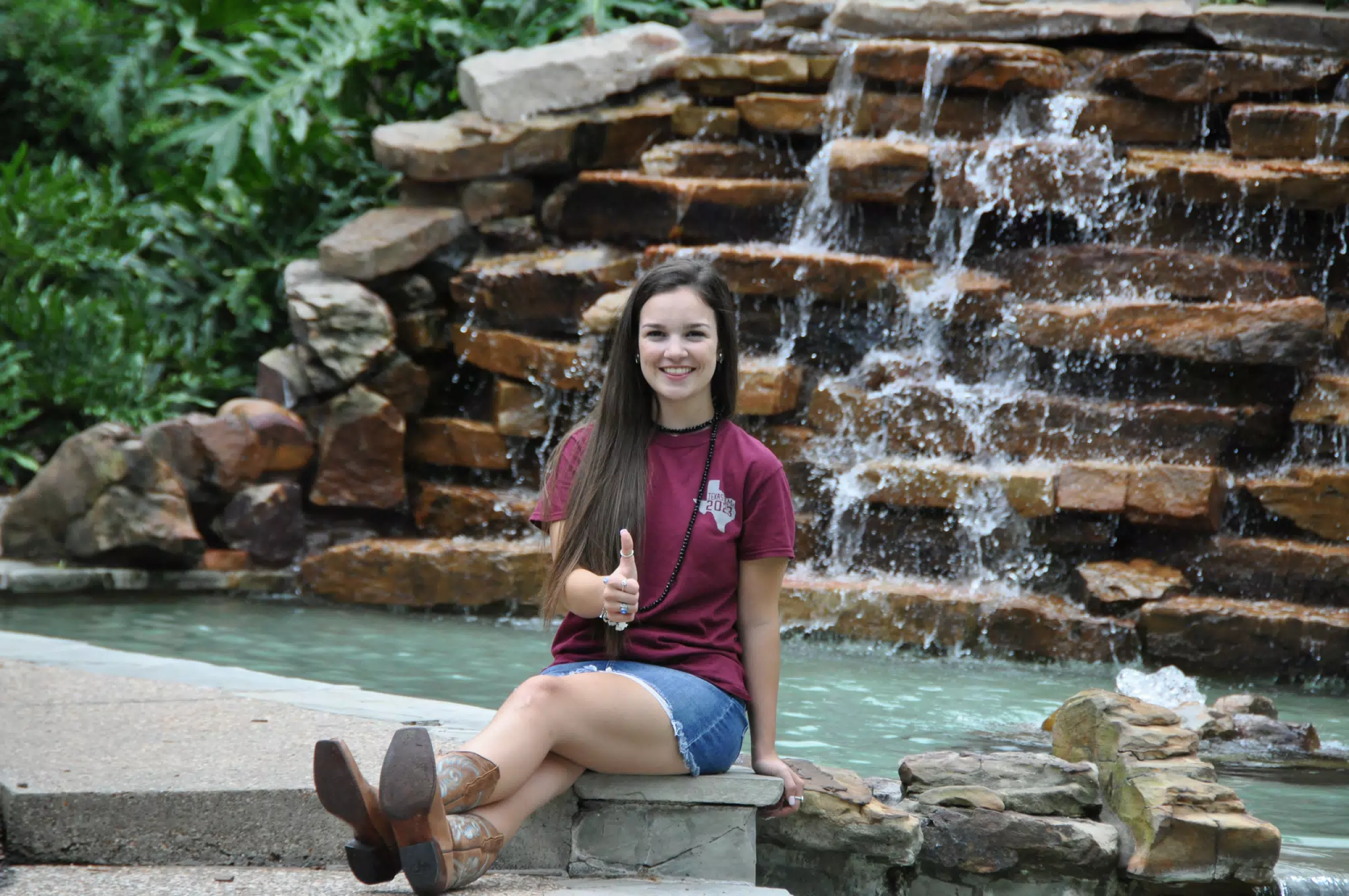 Emily Modeling with Waterfall in Cowboy Boots and Denim Miniskirt