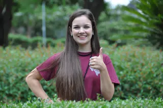 Teen Model Giving Thumbs Up in Texas Garden
