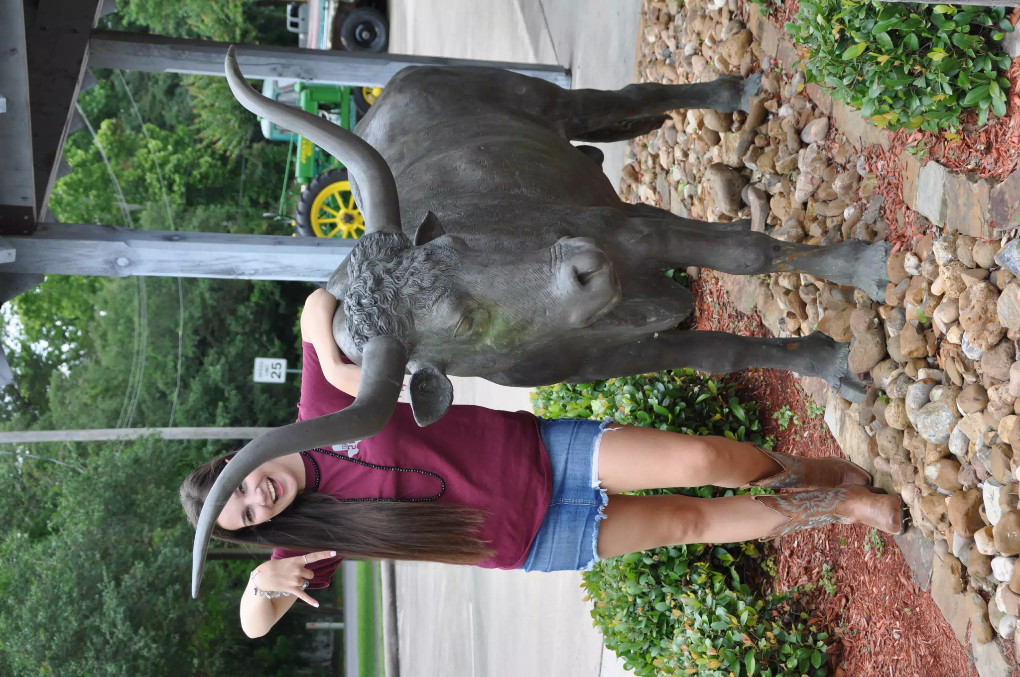Brunette Model in Denim Miniskirt with Longhorn in Texas
