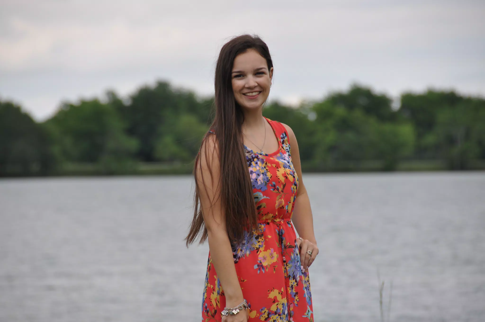 Emily with Tongue Out in Red Dress by Pond in Texas