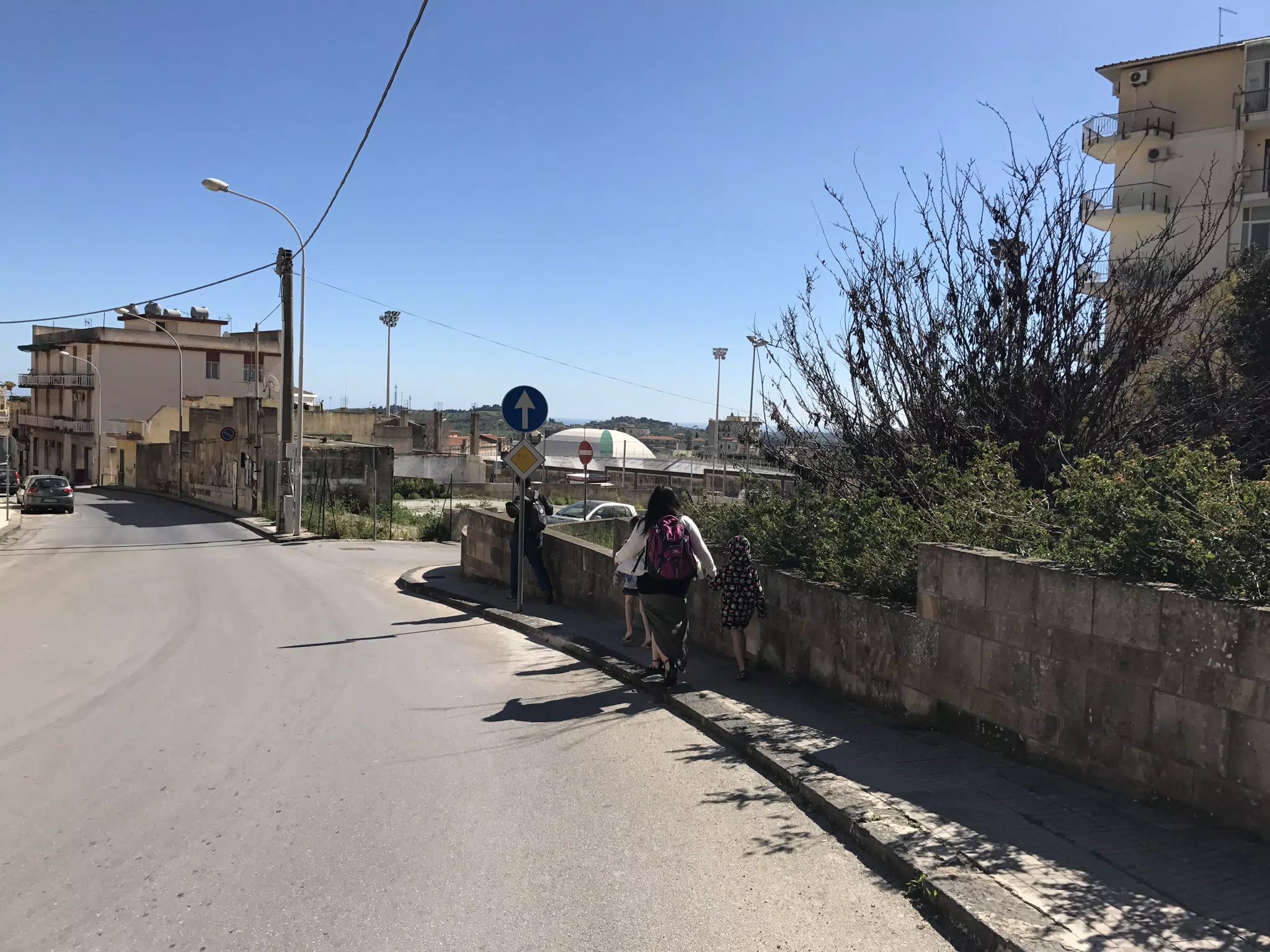 Miller Family Walking to the Bus in Noto