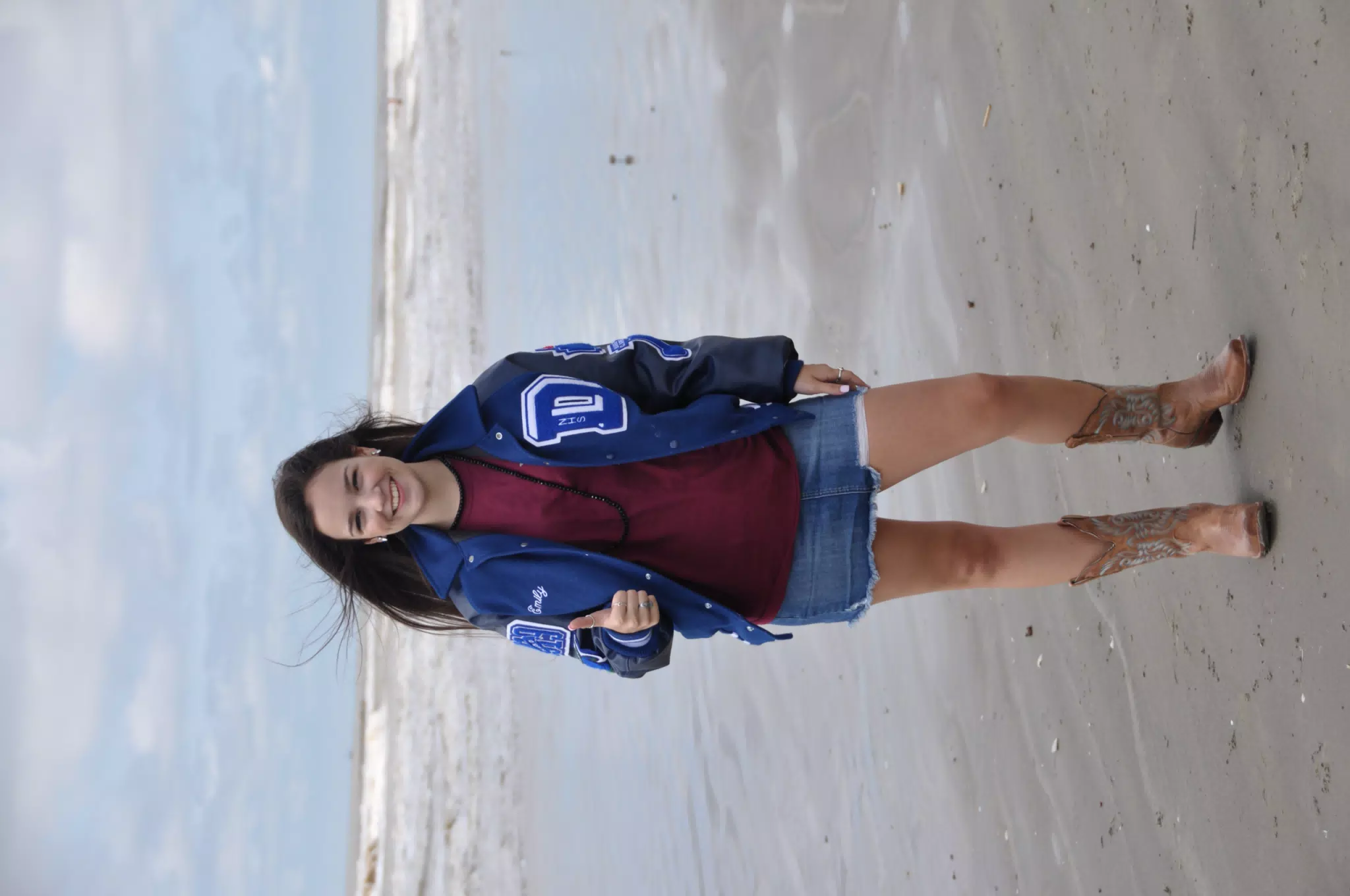 Brunette in Miniskirt Modeling on Beach with Cowboy Boots