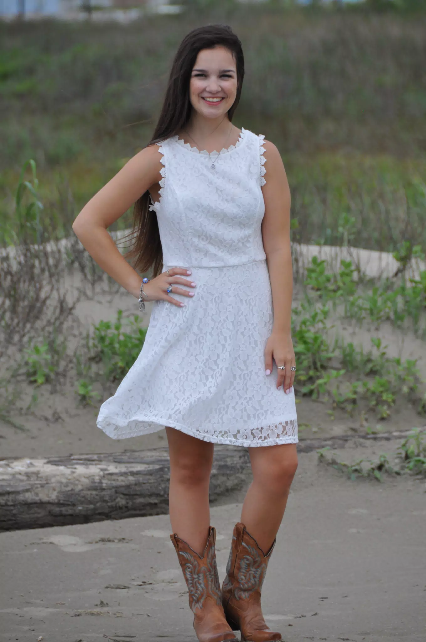 Teen Girl Posing in White Dress in Boots on Beach