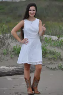 Girl in White Dress on Beach in Cowboy Boots